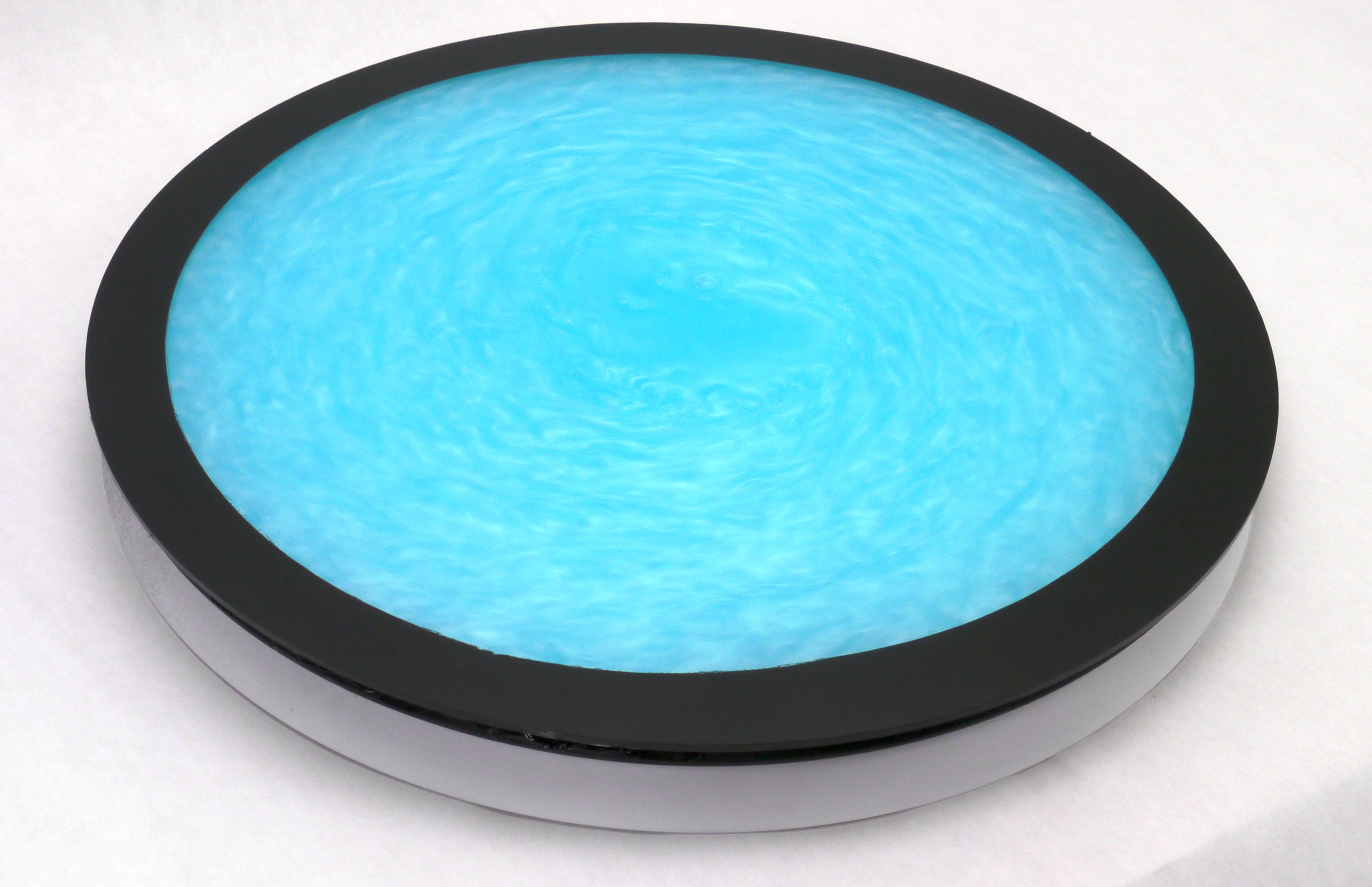 Colorful fluid-filled turntable shows mesmerizing turbulence